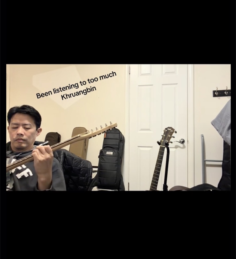 Aaron playing an electric guitar indoors, TikTok video thumbnail